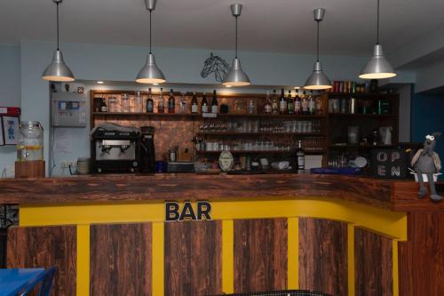 a bar with a bar sign on top of it at L Escale in Ports