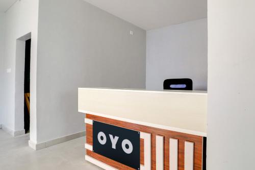 a reception desk in an office with a sign on it at Collection O RBS ECIL in Hyderabad
