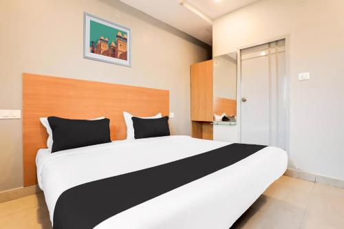 a bedroom with a large bed in a room at Collection O RBS ECIL in Hyderabad
