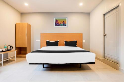 a bedroom with a large bed in a room at Collection O RBS ECIL in Hyderabad