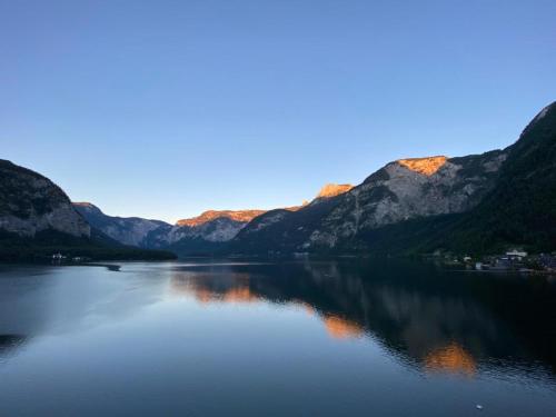 a large body of water with mountains in the background at Appartementgitti in Hallstatt