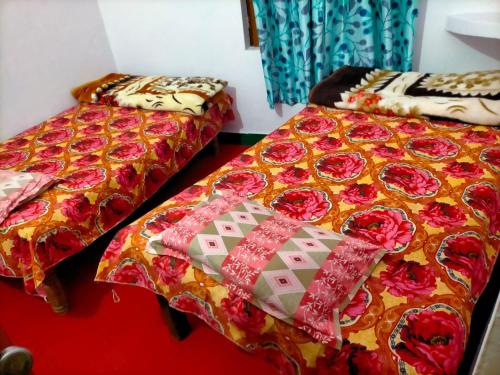 Ένα ή περισσότερα κρεβάτια σε δωμάτιο στο Vikas home stay
