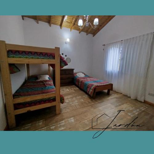 a bedroom with two bunk beds and a window at Casa en Costa Del Este in Costa del Este