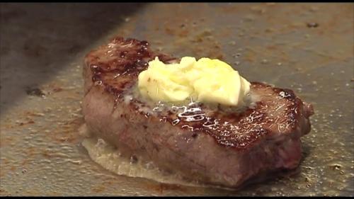 a piece of meat with butter on top of it at Gasthof Traube in Aspach