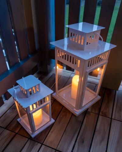 two toy houses with lights on a wooden floor at Surfers Studio with Beach, near Interlaken and Grindelwald in Därligen