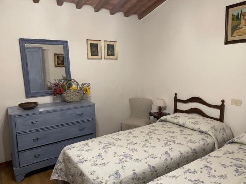 Ένα ή περισσότερα κρεβάτια σε δωμάτιο στο Agriturismo Podere Campalto