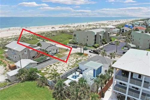 an aerial view of a house and the beach at Sun & Fun Oceanfront Saint Augustine Beach! in St. Augustine