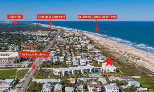 an aerial view of a beach with houses and the ocean at Sun & Fun Oceanfront Saint Augustine Beach! in St. Augustine