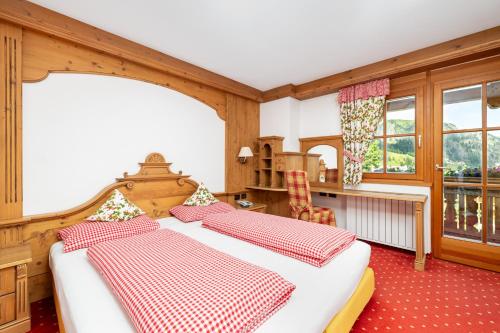 Postel nebo postele na pokoji v ubytování Chalet Barbara