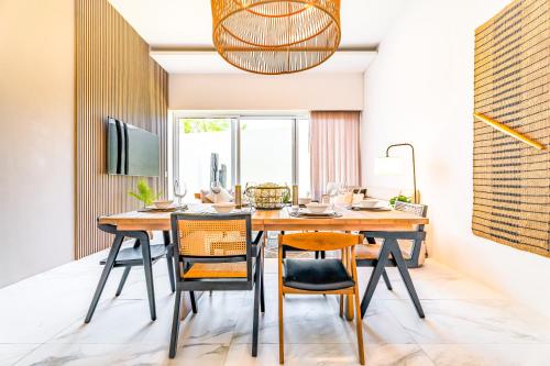 a dining room with a table and chairs at Casa Lucy Secure-Quiet & Opulent Cabo Retreat-3BR's & Patio! in Cabo San Lucas