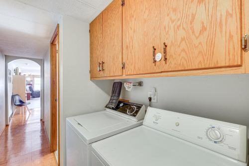 a washer and dryer in a kitchen with a cabinet at 2 Mi to Sturgis Motorcycle Rally Peaceful Home in Sturgis