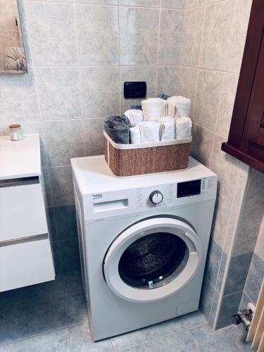 a washing machine with a basket on top of it at Venice Home perfect for Venice airport free parking in San Liberale