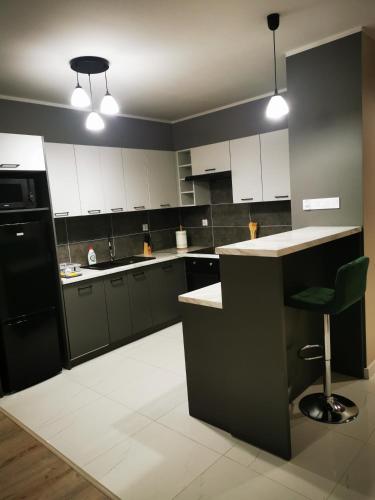 Η κουζίνα ή μικρή κουζίνα στο Urokliwy apartament