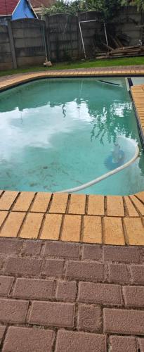 a pool of water with a hose in it at Nature's Retreat in Willowdene