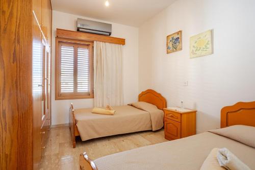 Postel nebo postele na pokoji v ubytování ARMA Resort, 2-bed Cosy Apartment
