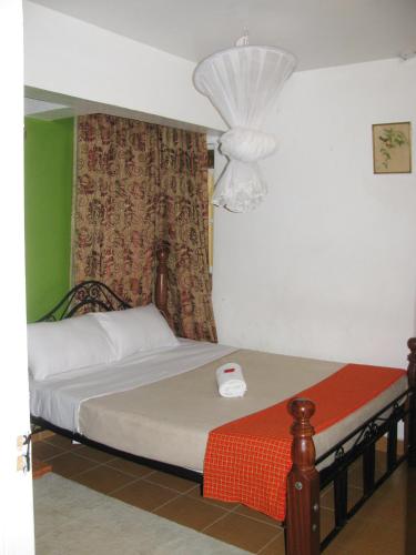 Llit o llits en una habitació de Lulu's Guest House