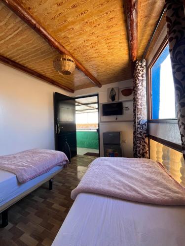 Postel nebo postele na pokoji v ubytování Ami d'or guest house