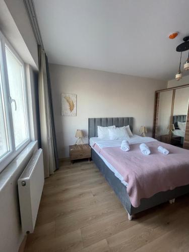 a bedroom with a bed with two towels on it at King Suite SS18 in Istanbul