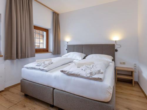 Postel nebo postele na pokoji v ubytování Gipfelblick Chalet Conny