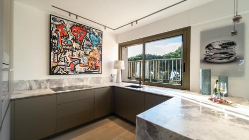 a kitchen with a sink and a window at Riviera luxury estates in Antibes