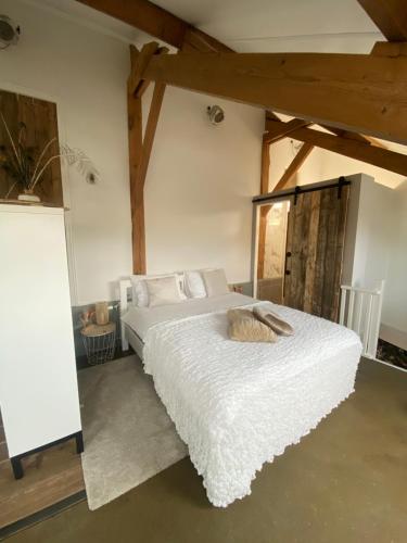 En eller flere senge i et værelse på B&B / Studio De Rozeboom