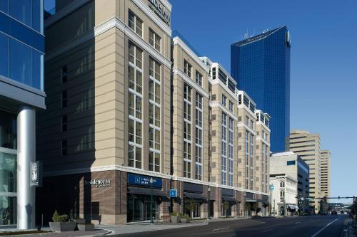 a tall building on a city street with buildings at Residence Inn by Marriott Lexington City Center in Lexington
