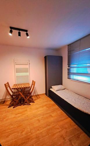 Ένα ή περισσότερα κρεβάτια σε δωμάτιο στο Apartament Ideos 7 osobowy