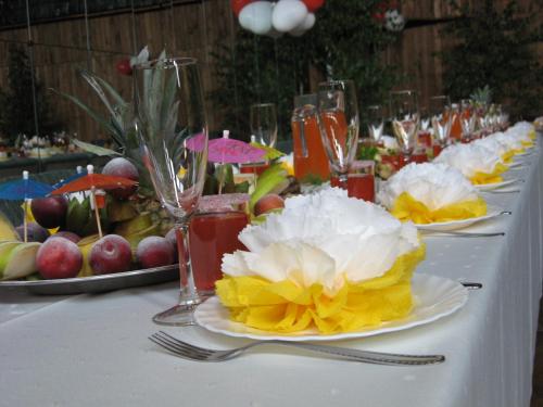 a table with plates of fruit and glasses on it at Daugavkrasti Hotel in Jēkabpils