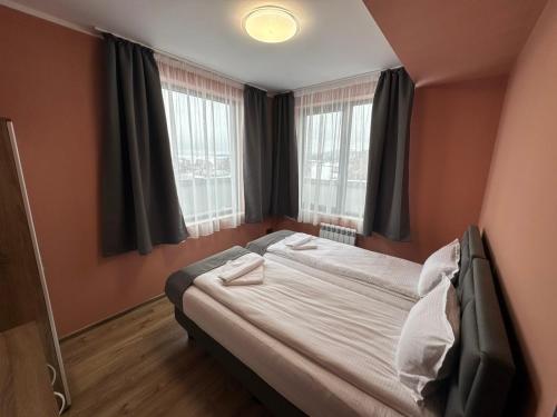 Ένα ή περισσότερα κρεβάτια σε δωμάτιο στο Rila View Apartments