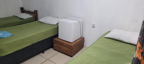 Postel nebo postele na pokoji v ubytování Hotel Toka do Skillo