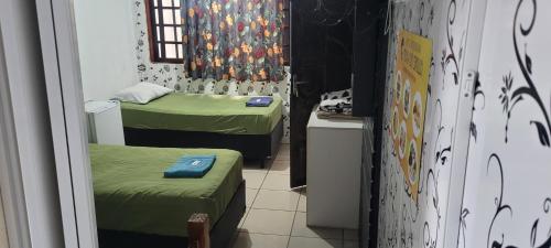 Postel nebo postele na pokoji v ubytování Hotel Toka do Skillo