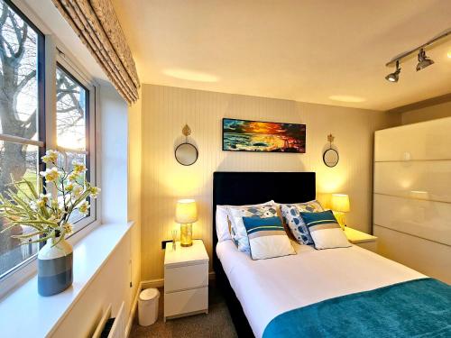 a bedroom with a bed and a window at The Birch homely retreat in Middlesbrough