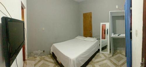 Cama o camas de una habitación en Pousada Estilo Brasil