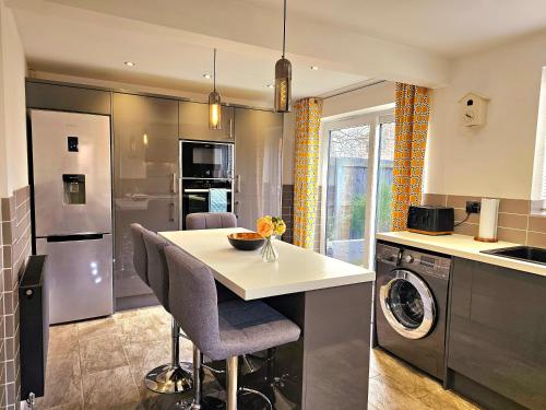 a kitchen with a counter and a dishwasher at The Birch homely retreat in Middlesbrough