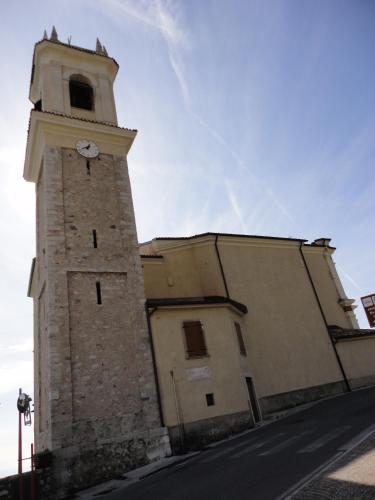 a building with a clock tower on the side of it at Ferienwohnung Maderno in Affoltern