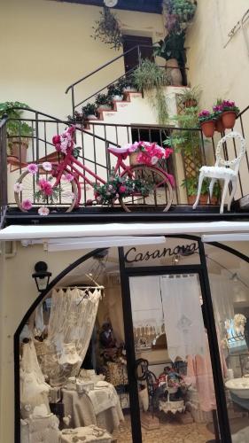 a pink bike parked in front of a store window at Ferienwohnung Maderno in Affoltern