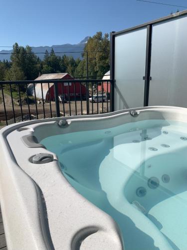 a jacuzzi tub in a building with a view at Stokeside Serenity in Revelstoke