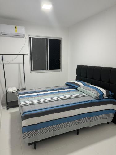 Postel nebo postele na pokoji v ubytování Apartamento aconchegante no Araçagy por temporada