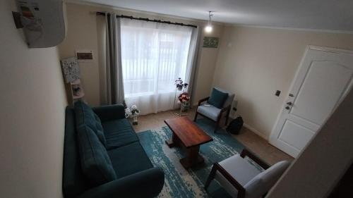 a living room with a couch and a table at arriendo casa independiente en Valdivia in Valdivia