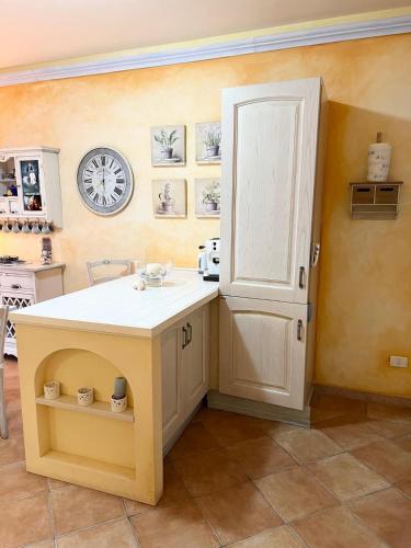a kitchen with a island in the corner of a room at Casa Lala in Palau