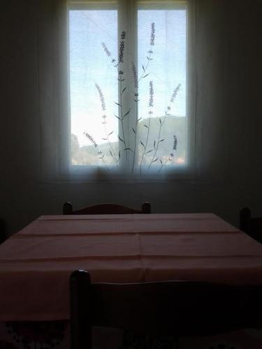 a bedroom with a bed and a window at Hotel Rustichello in Marina di Campo