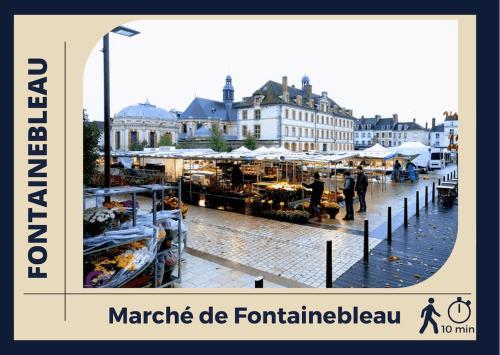 a picture of a market in a city with buildings at Le Logis de Fontainebleau - Appartement Confort - Centre in Fontainebleau