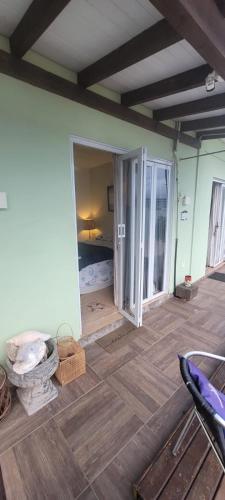 a room with a room with a wooden floor at Suites Villa Forte Santana in Florianópolis