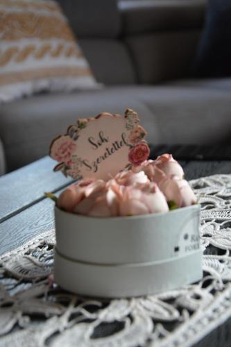 a cake in a bowl on a table at Téli Berek Vendégház in Abod