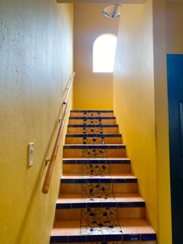 a stairway in a building with a bunch of stairs at Real Del Mar Tijuana Apt for 2 guests in Tijuana