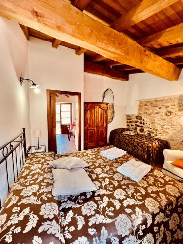 a bedroom with a large bed in a room at Agriturismo Montagna Verde Apella in Licciana Nardi