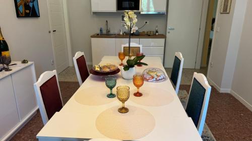 a kitchen with a table with glasses on it at AC GOLD B&B Boutique Rooms & Suite in Reggio Calabria