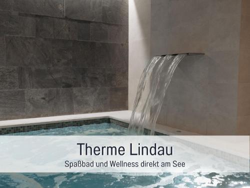 a shower with a water fountain in a bathroom at Gemütlich*Stylisch*Netflix*Blick ins Grüne* in Lindau