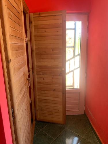 an open door in a room with a window at Domaine Alya in Sidi Bibi