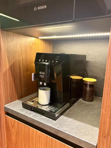 a coffee maker on a counter in a kitchen at Chalet Oasis - Luxury Retreat at Chalets Kvačianska Dolina in Zuberec